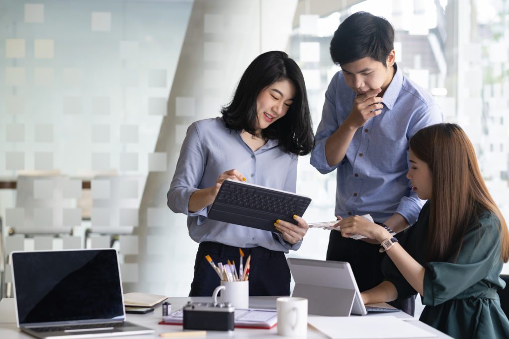 Young professionals looking at a tablet